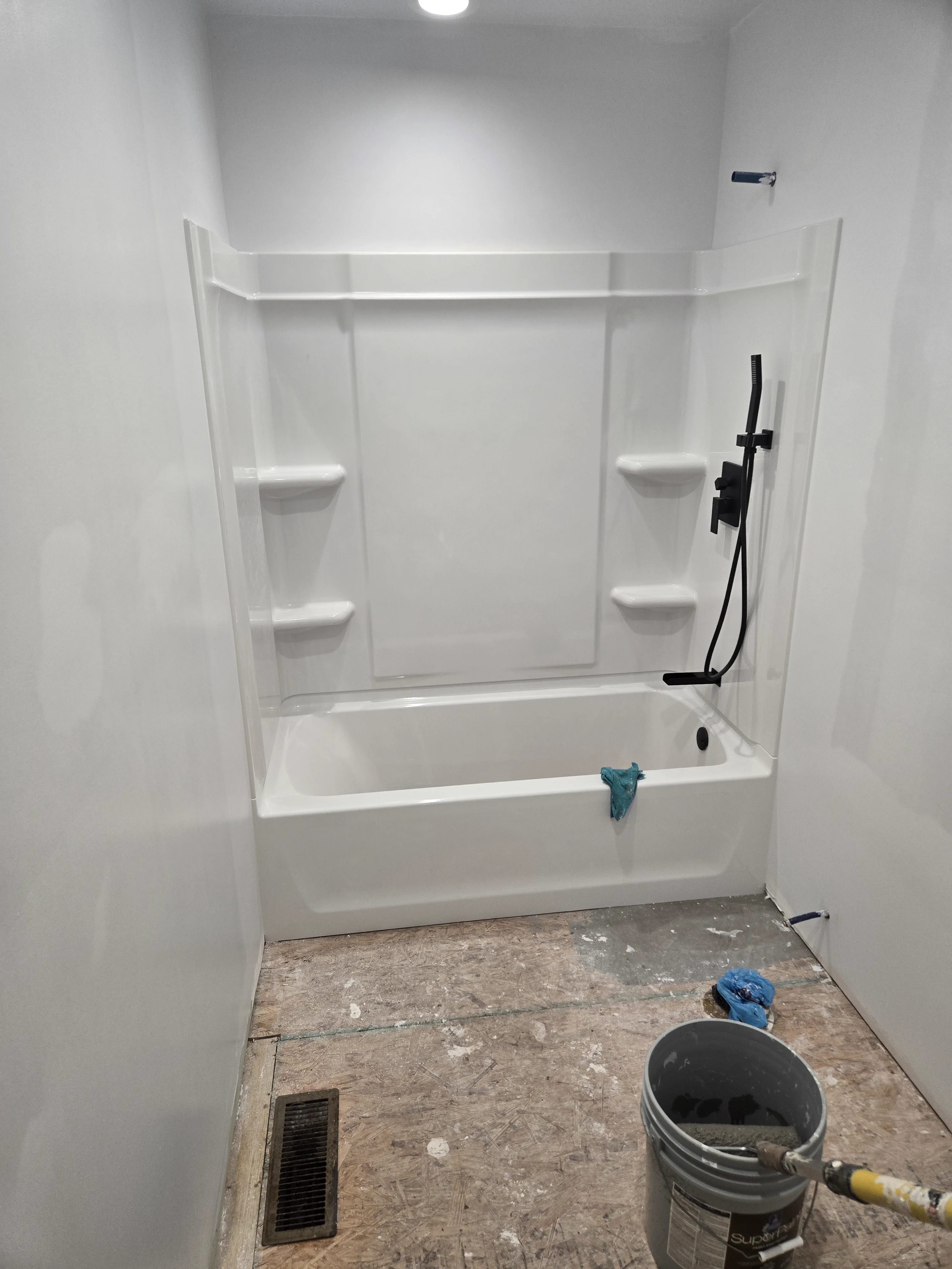 Quincy guest bath before the floor and glass door